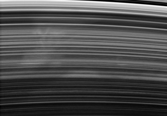 Spokes!
Caption NASA originale:"A broad and ghostly spoke drifts past under the Cassini spacecraft's gaze. The spoke-forming region of the B-Ring displays faint longitudinal variations in brightness, from left to right, a feature seen also in other images. 
This view looks toward the unlit side of the Rings from about 35° above the Ring-Plane. 

The image was taken in visible light with the Cassini spacecraft narrow-angle camera on Oct. 17, 2006 at a distance of approx. 2 MKM (such as about 1,3 MMs) from Saturn and at a Sun-Saturn-spacecraft, or phase, angle of 158°. Image scale is roughly 12 Km (about 7 miles) per pixel".
Parole chiave: Saturn's Rings - The "B" Ring