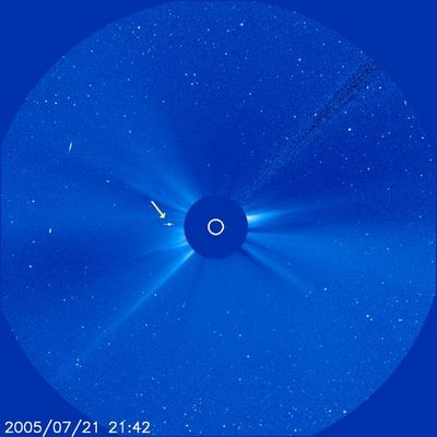 Saturn's "superior conjunction"
In this SOHO image taken July 21, 2005, the Sun is represented by the white circle in the center. Saturn is the bright object to the left of the Sun. Interestingly, the streak accompanying Saturn is not the rings but a distortion caused by Saturn's brightness. Saturn is approaching "superior conjunction," that is, it will be almost directly behind the Sun from Earth - thus the Cassini spacecraft, in orbit around Saturn, will not be able to send or receive transmissions normally. Regular science data collection has been temporarily suspended. 
As Cassini passes closest by the limb of the Sun on July 24 PDT, all the communications will be impossible because of the Sun's radio noise. The spacecraft will regain full communication with Earth on July 27, once again returning Saturn science data. In the meantime, controllers are sending approximately 100 commands per day to test communication status. Cassini radio scientists are taking advantage of this opportunity to study the Sun's corona from its effects on the radio signals that reach Earth. 

SOHO (Solar and Heliospheric Observatory Satellite) orbits the Sun parked in one of the five gravitational-neutral spots, called Lagrange Points. This specific spot, called L1, stays in the same place relative to the Sun and the Earth, offering a continuously uninterrupted view of the Sun. 


Parole chiave: The Sun from SOHO