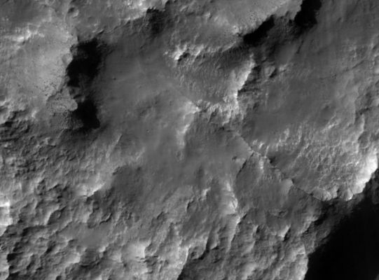 Atlantis Chaos
This HiRISE image covers a small area within a degraded crater adjacent to Atlantis Chaos in the Electris region of Mars. The crater and much of the surrounding region were once extensively mantled by a layer of material(s) of unknown origin and only small remnant outcrops of this material remain seen as flat topped mesas in the image sub-frame shown here. Intervening areas expose ancient uplands materials locally punctuated by narrow ridges that may represent more resistant material within the mantling deposit that were left in relief as the sediments were eroded away. Although the mesas do not appear to be comprised of finely layered materials, hints of some layering in a few locations can be seen. Large blocks of material are being shed from the mesas, but do not appear to accumulate on the mesa slopes as large talus aprons. Some wind blown dunes and ripples can be observed, but are not as widespread as in many other locations imaged with HiRISE. Collectively, these characteristics suggest that the material(s) forming the mantling deposit possess some limited strength, but are easily broken down and removed by wind over time. One possible Earth analog for these deposits may be the wind blown accumulations of very fine sediments, or silt known as loess.
Parole chiave: Mars from orbit - Atlantis Chaos