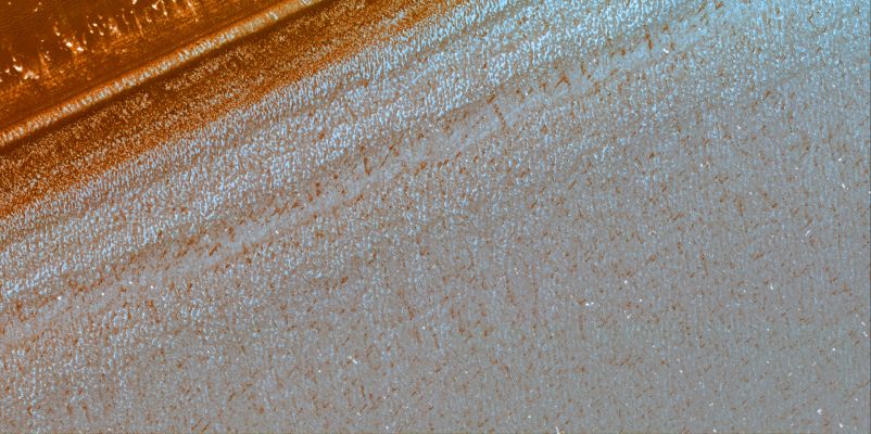 North Polar Layered Deposits (full image & HR)
This image of the north polar layered deposits was taken during the summer season (solar longitude of 113.6 degrees), when carbon dioxide frost had evaporated from the surface. The bright spots seen here are most likely patches of water frost, but the location of the frost patches does not appear to controlled by topography. Layers are visible at the bottom of the image, mostly due to difference in slope between them. The variations in slope are probably caused by differences in the physical properties of the layers. Thinner layers that have previously been observed in these deposits are visible, and may represent annual deposition of water ice and dust that is thought to form the polar layered deposits. These deposits are thought to record global climate variations on Mars, similar to ice ages on Earth. HiRISE images such as this should allow Mars' climate record to be inferred and compared with climate changes on Earth.
Parole chiave: Mars from orbit - North Polar Features - Layered Deposits