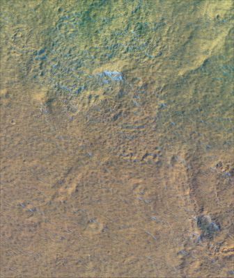 Niger Vallis (1)
This image shows a portion of the floor of Niger Vallis, an ancient Martian outflow channel. Niger Vallis originates on the flanks of the volcano Hadriaca Patera, and empties into the Hellas impact basin. Outflow channels are observed in many regions of the planet, and may have been carved by brief eruptions of liquid water from beneath the surface. Since Niger Vallis formed, impacts have cratered the channel floor, and fine-grained wind-blown debris has been transported across the surface, eroding and burying all but the freshest craters. The curved ridge in the scene may be the remnant of a large crater rim. At the high resolution of this image, a pattern of parallel dunes and ripples can be seen, as well as individual boulders as large as two meters across. 
Image TRA_000830_1440 was taken by the High Resolution Imaging Science Experiment (HiRISE) camera onboard the Mars Reconnaissance Orbiter spacecraft on September 30, 2006. The full image shown below is centered at -35.5 degrees latitude, 92.1 degrees East longitude. The range to the target site was 255 km (159 miles). At this distance the image scale is 51 cm/pixel (with 2 x 2 binning) so objects ~153 cm across are resolved. The image shown here has been map-projected to 50 cm/pixel and north is up. The image was taken at a local Mars time of 3:35 PM and the scene is illuminated from the west with a solar incidence angle of 77.5 degrees, thus the sun was about 12.5 degrees above the horizon. At a solar longitude of 113.8 degrees, the season on Mars is Northern Summer / Southern Winter. 


Parole chiave: Mars from orbit - Niger Vallis