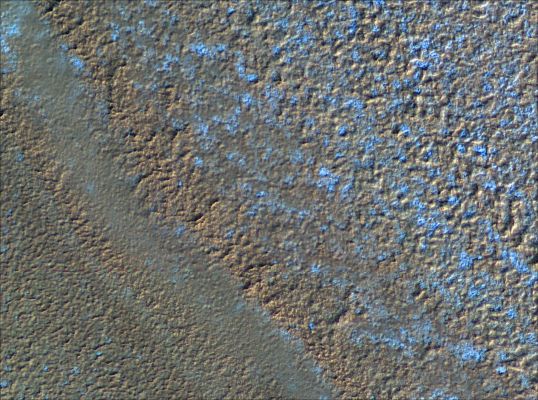 Chasma Boreale (1)
This is an image of the North Polar Layered Deposits (NPLD) near the source Region of Chasma Boreale. Chasma Boreale is the largest re-entrant trough in the NPLD, with its head region located roughly 300 Km from the North Pole and its mouth opening into the Northern Plains at the perimeter of the NPLD. Chasma Boreale is thought to have formed due to outflow of water from underneath the Polar Cap, or due to winds blowing off the Polar Cap, or a combination of both. 
Investigation of the currently visible layers around the source region may tell us if they have been deformed and down-dropped, perhaps by melting and flow of water beneath, or if they remain undisturbed. Layers here do not appear as fine as elsewhere in polar trough exposures, although this may be due to the relatively gently sloping exposure here.
Parole chiave: Mars from orbit - North Polar Features - Layers - Chasma Boreale