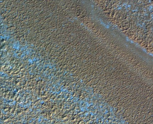 Chasma Boreale (2)
Different layers show very different degrees of roughness and pitting, although the texture within a layer is quite consistent. One of the layers even displays a texture of polygons 3 up to 10 mt across, normally associated with periglacial freeze-thaw processes on Earth. Layers of different texture, brightness, and appearance indicate differing physical properties, composition and exposure to surface environmental conditions at time of emplacement and/or erosion. 
In this way, polar layers on Mars record a history of climate conditions as sequences of layers on Earth often do. 
Parole chiave: Mars from orbit - North Polar Features - Layers - Chasma Boreale