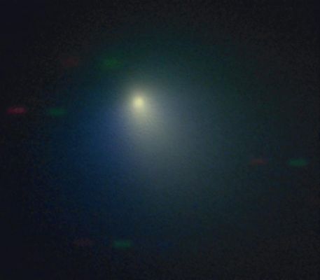 Tempel-1, from Kitt Peak (pseudo-colors)
Caption NASA originale:"The Kitt Peak National Observatory's 2,1-meter telescope observed comet Tempel 1 on April 11, 2005, when the comet was near its closest approach to the Earth. A pinkish dust jet is visible to the SouthWest, with the broader neutral gas coma surrounding it. North is up, East is to the left and the field of view is about 80.000 Km wide. The Sun was almost directly behind the observer at this time. The red, green and blue bars in the background are stars that moved between the individual images. 

This pseudo-color picture was created by combining three black and white images obtained with different filters. The images were obtained with the HB Narrowband Comet Filters, using CN (3870 A - shown in blue), C2 (5140 A - shown in green) and RC (7128 A - shown in red). 
The CN and C2 filters capture different gas species (along with the underlying dust) while the RC filter captures just the dust".
Parole chiave: From Earth Images - Kitt Peak National Observatory (USA)