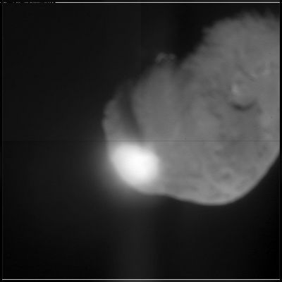 Impact Time!
When NASA's Deep Impact probe collided with Tempel-1, a bright, small flash was created, which rapidly expanded above the surface of the comet. This flash lasted for more than a second and its overall brightness is close to that predicted by several models. After the initial flash, there was a pause before a bright plume quickly extended above the comet surface. The debris from the impact eventually cast a long shadow across the surface, indicating a narrow plume of ejected material, rather than a wide cone. The Deep Impact probe appears to have struck deep, before gases were heated and explosively released. The impact crater was observed to grow in size over time. A preliminary interpretation of these data indicate that the upper surface of the comet may be fluffy, or highly porous. The observed sequence of impact events is similar to laboratory experiments using highly porous targets, especially those that are rich in volatile substances. The duration of the hot, luminous gas phase, as well as the continued growth of the crater over time, all point to a model consistent with a large crater.

Parole chiave: Comet Tempel-1