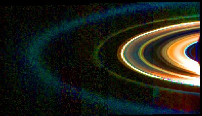 Infrared Rings
This mosaic of Saturn's rings was acquired by Cassini's VIMS (Visual and Infrared Mapping Spectrometer) on Sept. 15, 2006, while the spacecraft was in the shadow of the Planet looking back towards the Rings from a distance of about 2,16 MKM (approx. 1,34 MMs). 
Data at wavelengths of 1,0, 1,75 and 3,6 microns were combined in the blue, green and red channels to make the pseudo-color image shown here. The brightest feature in the mosaic is the F-Ring, located at the outer edge of the main Rings. The F-Ring is overexposed and appears white in this image. Of the main A, B and C Rings; the C-Ring is the most prominent and reddish in color, becoming saturated close to the Sun. The more opaque A and B Rings are muddy in color and very dark in this geometry. 
By contrast, the normally faint D-Ring, located just interior to the C-Ring, is quite bright and blue, indicating the presence of very small ring particles. Similarly, a narrow, green ringlet in the Cassini Division, as well as the greenish G-Ring and blue E-Ring - located at increasing distances outside the F-Ring - are predominantly composed of small particles. 
The faint reddish band immediately outside the F-Ring is likely to be an artifact caused by the extremely bright F-Ring. 

Parole chiave: Saturn's Rings