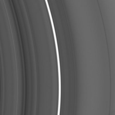 Deep inside the "C-Ring"
Original caption:"This close-up view shows an inner region of Saturn's C-Ring. It covers a radial location on the rings located approx. 78.000 to 80.500 Km (about 48.500 to 50.000 miles) from the center of the Planet. Saturn itself has a radius of 60.330 Km (that is about 34.490 miles). 
A bright feature, informally referred to as a "plateau", arcs across the image center. The plateau is not high in terms of elevation, but rather in terms of particle density (seen here as brightness). The density is fairly uniform within the bright band, and some five times higher than in the surrounding ring structure. Although the many plateaus in Saturn's Rings appear unchanged over 25 years of observations, scientists do not know what determines their locations or maintains their sharp boundaries. 
The image was taken in visible light with the Cassini spacecraft narrow-angle camera on Sept. 5, 2005, at a distance of approx. 418.000 Km(such as about 260.000 miles) from Saturn. The image scale is 2 Km per pixel".
Parole chiave: Saturn's Rings - The "C-Ring"