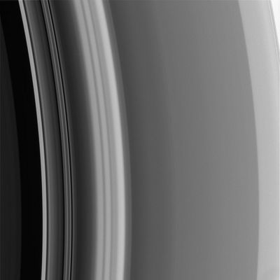 The "Cassini" Division (close-up)
Original caption:"The outer reaches of Saturn's Cassini Division merges with the inner A-Ring (at the right) in a Region that is rich in structure. 
The smooth Region leading up to the A-Ring grows brighter from the left to the right (known as a "ramp" to Ring). 
This Region contains a faint "double-wave" structure that is a density feature caused by the influence of the co-orbital moons Janus and Epimetheus. Scientists are interested in observing the evolution of this density wave as the moons swap places in their orbits every few years, presumably resulting in a change in the perturbations that cause this feature. 
This image was taken in visible light with the Cassini narrow-angle camera on Sept. 5, 2005, at a distance of approx. 441.000 Km (about 274.000 miles) from Saturn. The image scale is 2 Km (a little more than 1 mile) per pixel".
Parole chiave: Saturn's Rings - The "A-Ring" and the Cassini Division