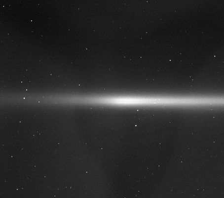 The "E-Ring" of Saturn: the "Enceladus Ring" (1)
This excellent view of the faint E-Ring - a ring feature now known to be created by Enceladus - also shows two of Saturn's small moons that orbit within the Ring, among a field of stars in the background. 
The E-Ring extends from three to eight Saturn radii - about 180.000 Km(such as about 118.000 miles) to 482.000 Km (about 300.000 miles). Its full extent is not visible in this view. 

Calypso (22 Km, or about 14 miles across) and Helene (32 Km, or about 20 miles across) orbit within the E-Ring's expanse. Helene skirts the outer parts of the E-Ring, but here it is projected in front of a region deeper within the Ring. 
Calypso and Helene are trojan satellites, or moons that orbit 60° in front or behind a larger moon. Calypso is a Tethys trojan and Helene is a trojan of Dione. An interesting feature of note in this image is the double-banded appearance of the E-Ring, which is created because the Ring is somewhat fainter in the Ring-Plane than it is 500-1000 Km (about 300-600 miles) above and below it.
Parole chiave: Saturn's Rings - the E-Ring