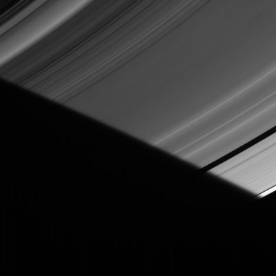 "Penumbral fade" on Saturn's Rings
Caption NASA:"As the particles comprising Saturn's A-Ring slip into the Planet's shadow, they find themselves briefly in the penumbra of Saturn's shadow. In this very narrow region along the edge of the shadow, part (but not all) of the Sun is still visible around the side of the Planet, creating only a partial shadow there and making the shadow edge look fuzzy. 

The image was taken in visible light with the Cassini spacecraft narrow-angle camera on July 26, 2006 at a distance of approx. 1,5 MKM (such as about 900.000 miles) from Saturn. Image scale is roughly 9 Km (about 5 miles) per pixel".
Parole chiave: Saturn's Rings - The "A" Ring