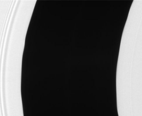 The Music of Pan...The Waves in the Rings...
Caption NASA:"The Encke Gap displays gentle waves in its inner and outer edges that are caused by gravitational tugs from the small moon Pan. These scalloped edges were captured in a dramatic image taken by Cassini during its insertion into Saturn orbit in 2004. 
The Encke Gap is a 325-Km (about 200-mile) wide division in Saturn's outer A-Ring. 
Pan (26 Km, or approx. 16 miles across) orbits squarely in the center of this gap. 
The original image was stretched in the horizontal direction by a factor of four to exaggerate the amplitude of the waves, then reduced to half size and cropped to focus on the gap. 

The image was taken in visible light with the Cassini spacecraft narrow-angle camera on July 23, 2006 at a distance of approx. 290.000 Km(such as about 180.000 miles) from Saturn. 
Scale in the original image was roughly 1 Km (about 0,6 mile) per pixel".
Parole chiave: Saturn's Rings - The Encke Gap in the "A" Ring