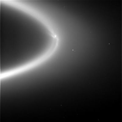 An enormous "clump" in Saturn's Rings? No: that's Enceladus!
Caption NASA:"W00017896.jpg was taken on September 15, 2006 and received on Earth September 17, 2006. The camera was pointing toward the Rings of Saturn that, at the time, were approximately 2.227.319 Km away.
The image was taken using the CL1 and IRP90 filters. This image has not been validated or calibrated".

Wispy fingers of bright, icy material reach tens of thousands of kilometers outward from Saturn's moon Enceladus into the E-Ring, while the moon's active South Polar jets continue to fire away. This astonishing, never-before-seen structure is made visible with the Sun almost directly behind the Saturn System from Cassini's vantage point. The phase angle here is 175°, a viewing geometry in which structures made of tiny particles brighten substantially. These features are very likely the result of particles injected into Saturn orbit by the Enceladus geysers: those injected in the direction of the moon's orbital motion end up on larger, slower orbits and trail Enceladus in its orbit, and those injected into the opposite direction end up smaller, faster orbits and lead Enceladus. (Orbital motion is counter-clockwise.) In addition, the configuration of wisps may hint at an interaction between Saturn's magnetosphere and the torrent of particles issuing from Enceladus. 

In addition to the wisps, another unexpected detail is the dark gore in the center of the ring, following the moon in its orbit, likely brought about by the sweeping action of Enceladus as it orbits in the center of the E ring. 

The view looks down onto Enceladus (505 kilometers, or 314 miles across) from about 15 degrees above the ringplane. Tethys (1,071 kilometers, or 665 miles across) is visible to the left of Enceladus. 

The image was taken in visible light with the Cassini spacecraft wide-angle camera on Sept. 15, 2006, at a distance of approximately 2.1 million kilometers (1.3 million miles) from Enceladus. Image scale is 128 kilometers (80 miles) per pixel.

Parole chiave: Saturn's Rings