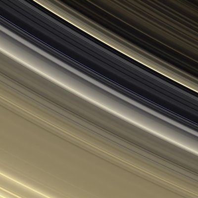 The A and B-Rings (and the Cassini Division) in natural colors (Credits: NASA/JPL/Space Science Institute)
The Rings are awash in subtle tones of gold and cream in this view which shows the outer B-Ring, the Cassini Division and the inner part of the A-Ring. In this viewing geometry, the brightest feature in the Cassini Division is the recently discovered diffuse Ringlet near the outer edge of the Division. 
The diffuse Ringlet has a distinctive bluish cast. 
The color of the Rings appears more golden than earlier in the mission because of the viewing geometry here - increased scattering in the Rings is brought about by the high phase angle and the view being toward the Rings' unlit side. This view looks toward the unlit side of the rings from about 30° above the Ring-Plane. 

Images taken using red, green and blue spectral filters were combined to create this natural color view. The images were acquired by the Cassini spacecraft narrow-angle camera on Sept. 29, 2006 at a distance of approx. 1,8 MKM (about 1,13 MMs) from Saturn. Image scale is roughly 11 Km (about 7 miles) per pixel.
Parole chiave: Saturn's Rings - The "A" and "B" Rings plus the Cassini Division