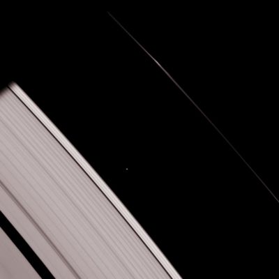 Heading to the Darkness
Caption NASA:"This strikingly crisp view shows Atlas heading into Saturn's shadow at upper left. The moon's basic, elongated shape is easy to detect here. Above Atlas, a bright clump in the F-Ring also heads toward the darkness. This view looks toward the unlit side of the Rings from about 30° above the Ring-Plane. 

The image was taken in visible light with the Cassini spacecraft narrow-angle camera on Jan. 19, 2007 at a distance of approx. 1,2 MKM (about 700.000 miles) from Atlas. Image scale is roughly 7 Km (about 4 miles) per pixel".
Parole chiave: Saturn's Moons - Atlas