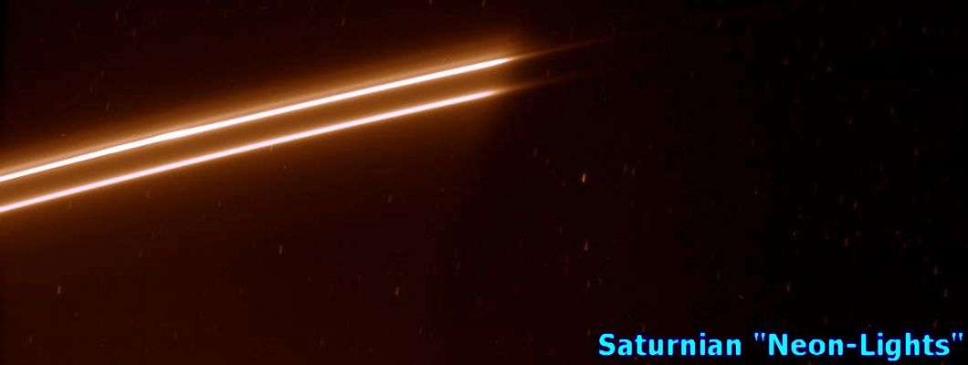 F-Ring or just "Saturnian Neon-Lights"?...
Caption NASA:"Bright strands in Saturn's ever changing F-Ring emerge from the Planet's shadow. The F-Ring usually has a single bright core, about 50 Km (31 miles) across, but the section of the ring seen here appears to have a second bright strand. 

Several background stars are visible by the trails they created while the image was being exposed. 

This view looks toward the unlit side of the Rings from about 59° above the Ring-Plane. 

The image was taken in visible light with the Cassini spacecraft narrow-angle camera on Feb. 9, 2007 at a distance of approx. 1,7 MKM (about 1,1 MMs) from Saturn. 
Image scale is roughly 10 Km (about 6 miles) per pixel".
Parole chiave: Saturn's Rings - The "F" Ring