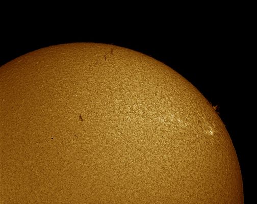 The Sun and Mercury
Enjoying the transit of Mercury from Dallas, Texas, astronomer Phil Jones recorded this detailed image of the Sun. Along with a silhouette of the innermost Planet, a network of cells and dark filaments can be seen against a bright solar disk with spicules and prominences along the Sun's edge. The composited image was taken through a telescope equiped with an H-alpha filter that narrowly transmits only the red light from Hydrogen atoms. Such images emphasize the Solar Chromosphere, the region of the Sun's atmosphere immediately above its Photosphere or normally visible surface. Left of center, the tiny disk of Mercury seems to be imitating a small sunspot that looks a little too round. But in H-alpha pictures, sunspot regions are usually dominated by bright splotches (called plages) on the Solar Chromosphere.
Parole chiave: From Earth Pictures - Amatorial Pictures