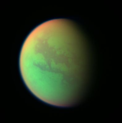 Titan in three different wavelenghts: the strange Titan (3)
Caption NASA originale:"This false-color composite was created with images taken during the Cassini spacecraft's closest flyby of Titan on April 16, 2005. 
It was created by combining 2 infrared images (taken at 938 and 889 nnmts) with a visible light image (taken at 420 nnmts). Green represents areas where Cassini is able to see down to the surface. Red represents areas high in Titan's stratosphere where atmospheric methane is absorbing sunlight. Blue along the moon's outer edge represents visible violet wavelengths at which the upper atmosphere and detached hazes are better seen. 

A similar false-color image showing the opposite hemisphere of Titan was created from images taken during Cassini's first close flyby of the smoggy moon in October 2004 (see PIA06139). At that time, clouds could be seen near Titan's South Pole, but in these more recent observations no clouds are seen. North on Titan is up and tilted 30° to the right".

Parole chiave: Saturn's Moons - Titan