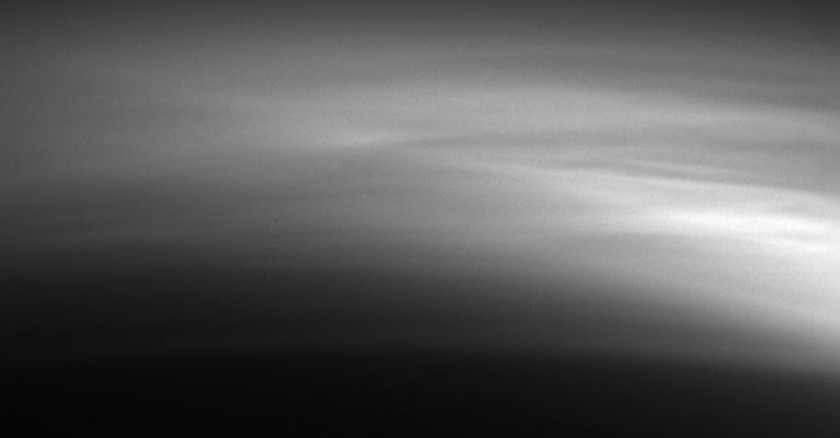 The "Hig-Haze Layers" of Titan
Caption NASA originale:"Titan's "High Haze Layers" are amazing. Cassini captured this detailed view of the relatively faint haze in Titan's upper atmosphere as it receded from its close encounter on March 31, 2005. Similar examples of such complex structures in Titan's haze have been observed previously by Cassini. These observations will help reveal the processes responsible for forming the numerous layers that we see and how the structure and behavior of the layers change on daily and seasonal time scales. 
The image was taken with the Cassini spacecraft narrow-angle camera using a filter sensitive to wavelengths of ultraviolet light centered at 338 nnmts and at a distance of 102.320 Km from Titan. Image scale is about 600 mt per pixel".
Parole chiave: Saturn's Moons - Titan