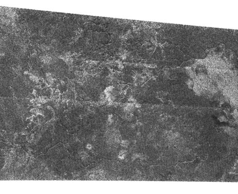 Canyonland on Titan
Fluids have flowed and cut these deeply-incised channels into the icy surface of Titan as seen in this SAR image. The channels are roughly 1 Km across (about 0,6 miles) and perhaps 200 mt deep (about 650 feet); some can be traced as far as 200 Km (about 120 miles). Many of them have angular segments suggesting they may follow faults in Titan's crust. 
Taken together with the two other radar passes (October 2004 and February 2005), these very HR images have identified at least two distinct types of drainage and channel formation on Titan. The style shown in this image consists of long valleys following angular patterns without many tributaries, suggesting that fluids flow over great distances.
This Cassini radar image was acquired as a part of the Titan flyby observations taken on Sept. 7, 2005, from a distance of about 2000 Km. The area is located at about 55° South Latitude, 7,5° West Longitude and extends over 300 km (about 186 miles) right to left.
Parole chiave: Saturn's Moons - Titan