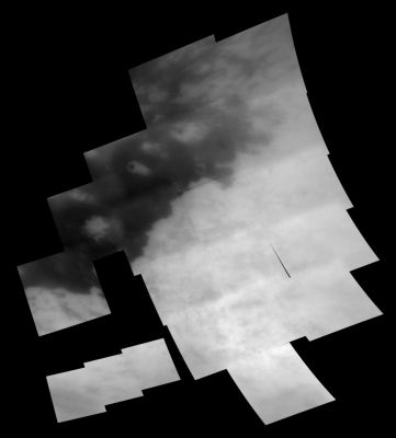 Titanian Clouds (December 2004 fly-by)
Caption NASA originale:"Cutting through the middle of the image is a sharp boundary between the bright region known as Xanadu Regio on the right and dark terrain to the left. This mosaic includes some areas seen at regional scales in October 2004 (see PIA 06124), as well as additional areas to the north and east not seen during that flyby. Among the new features seen in this mosaic is a strangely shaped bright feature near the center of the image as well as clouds near the bottom of the image (see also PIA 06110). The northern portion of the bright/dark boundary appears to be more complex than the arching and sharp boundary seen farther to the south. Cassini scientists continue to examine images such as this to determine the cause of this terrain. The images in this mosaic have been processed to enhance surface features and sharpen brightness variations".
Parole chiave: Titan's mosaic