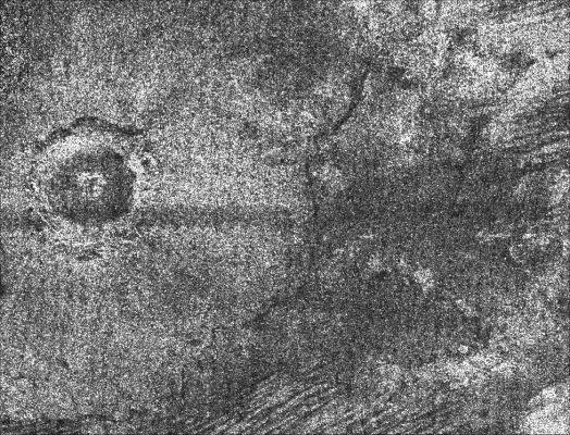 Titanian Crater
Caption NASA originale:"This image from Cassini's radar instrument shows an impact crater with a diameter of about 30 Km (19 miles) on the surface of Saturn's moon Titan. Cassini data have only revealed 3 definite impact craters on Titan so far, so each new discovery adds significantly to our body of knowledge. Impact craters are particularly important, as their shapes give scientists insight into the structure of the crust beneath Titan's surface. The difference in overall appearance between this crater, which has a central peak, and those without, such as Sinlap, indicates variations in the conditions of impact, thickness of the crust, or properties of the meteorite that made the crater. The dark floor indicates smooth or highly absorbing materials. 

This image was acquired by the Cassini radar instrument in synthetic aperture mode during a Sept. 7, 2006, flyby of Titan.
This image is centered at 70° West Long.; 10° North Lat. and measures about 145 Km high by 180 Km wide (such as approx. 93 by 118 miles). The smallest details in this image are about 500 mt (approx. 550 yards) across".
Parole chiave: Saturn's Moons - Titan