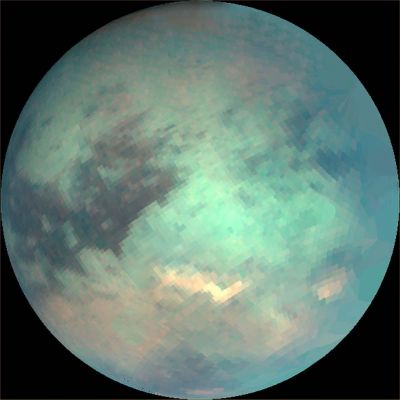 Titan: Visual + IMS (1)
The three mosaics shown here were composed with data from Cassini's visual and infrared mapping spectrometer taken during the last 3 Titan flybys, on Oct. 28, 2005 (1), Dec. 26, 2005 (2), and Jan. 15, 2006 (3). 
These false-color images were constructed from images taken at the following wavelengths: 1,6 microns (blue), 2,01 (green), and 5 microns (red). 

The viewing geometry of the December flyby is roughly on Titan's opposite Hemisphere from the flybys in October and January. 
There are several important features to note in the images. The first is that the South Polar cloud system was very bright during the December flyby, while during the October and January flybys, it is barely visible, indicating that the atmosphere over Titan's South Pole is very dynamic.
Parole chiave: Saturn's Moons - Titan