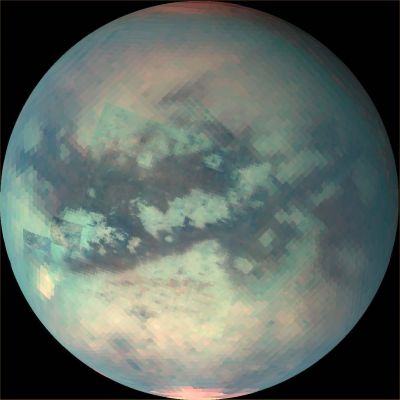 Titan: Visual + IMS (2)
In the December (2) mosaic, a North Polar hood that is bright at 5 microns is visible. Its composition is unknown. 
The North Polar hood is barely seen in the October (1) and January (3) data. 
Visible in the October and December images just South of the Equator is Tui Reggio, a Region nicknamed the "chevron". This Region is very bright at 5 microns and is among the brightest features on Titan at that wavelength. 
Tui Reggio is thought to be a surface deposit, probably of volcanic origin, and may be water and/or carbon dioxide frozen from the vapor. 
The December flyby data show that the western margins of Tui Reggio have a complex flow-like character consistent with eruptive phenomena.
Parole chiave: Saturn's Moons - Titan