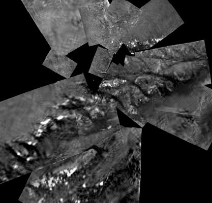 Huygens Landing Site
Caption NASA originale:"This mosaic from the Descent Imager/Spectral Radiometer camera on the European Space Agency's Huygens probe combines 17 image triplets, projected from an altitude of 800 mt (approx. 2.625 feet). 
The area covered is approximately 1,3 Km across (North at the top of the image). The smallest visible objects visible are less than 5 mt across and the dark channels are 30 to 40 meters (approx. 98 to 131 feet) wide. 
The images were then stitched together using one of several projection algorithms (in this case 'gnomonic') to produce a full mosaic. The images used to construct this mosaic were taken on Jan. 14, 2005".

Commento: a nostro parere si tratta di immagini complesse (e piuttosto confuse), estremamente difficili da interpretare in maniera convincente (almeno sulla base di ricostruzioni come queste due che Vi abbiamo proposto).
Parole chiave: Saturn's Moons - Titan