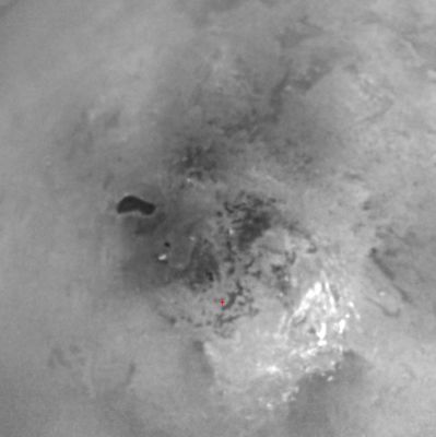Ontario Lacus and the South Polar Regions of Titan
This view of Titan's South Polar Region reveals an intriguing dark feature that may be the site of a past or present lake of liquid hydrocarbons. 
The true nature of this feature, seen here at left of center, is not yet known, but the shore-like smoothness of its perimeter and its presence in an area where frequent convective storm clouds have been observed by Cassini and Earth-based astronomers make it the best candidate thus far for an open body of liquid on Titan. 
If this interpretation is correct, then other very dark but smaller features seen in the South Polar Region, some of which are captured in this image, may also be the sites of liquid hydrocarbon reservoirs. 
In addition to the notion that the dark feature is or was a lake filled with liquid hydrocarbons, scientists have speculated about other possibilities. For instance, it is plausible that the lake is simply a broad depression filled by dark, solid hydrocarbons falling from the atmosphere onto Titan's surface. In this case, the smoothed outline might be the result of a process unrelated to rainfall, such as a sinkhole or a volcanic caldera. 

Parole chiave: Saturn's Moons - Titan - Controversial Image