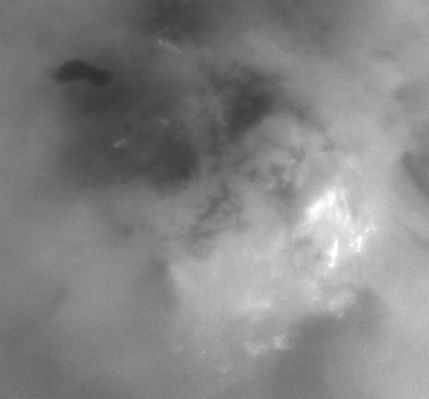Ontario Lacus and the South Polar Regions of Titan
Caption NASA originale:"Although it is far too cold for blossoming flowers, summer does bring storm clouds and presumably rain to Titan's south polar region. 
The observed persistence of convective storm activity in the region during the Southern Titan Summer has led scientists to speculate that the dark, footprint-shaped feature near the upper left could be a past or present reservoir for Titan's methane rains".
Parole chiave: Saturn's Moons - Titan - Controversial Image
