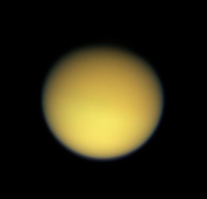 The "yellow face" of Titan (natural colors)
Caption NASA originale:"There is a slight difference in brightness from Northern to Southern hemisphere of Titan, a seasonal effect that was noted in NASA's Voyager spacecraft images, and is also clearly visible in some of the infrared images from Cassini (see http://photojournal.jpl.nasa.gov/catalog/PIA06121). 
The Northern polar region is largely in darkness at this time. 
This image was taken with the Cassini spacecraft wide angle camera through using red, green and blue spectral filters were combined to create this natural color view. The image was acquired at a distance of approximately 229.000 Km from Titan and at a phase, angle of 20°. Resolution in the image is about 14 Km per pixel".
Parole chiave: Saturn's Moons - Titan