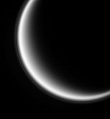 The "haze" of Titan
Original caption:"Looking back toward the sun brings out the thin haze that hovers 500 Km (310 miles) above Saturn's moon Titan. 
The haze is composed of small particles whose diameter is comparable to the wavelength of light, which is ultraviolet light centered at 338 nnmts. Particles of this scale scatter sunlight most effectively in the direction opposite to the direction of sunlight itself. 
Scientists are still trying to understand what processes produce this thin, high-altitude haze layer. 

Picture data: North on Titan is up and tilted 10° to the right. The image was taken with the Cassini spacecraft narrow-angle camera on Sept. 24, 2005, at a distance of approx. 917.000 Km (about 570.000 miles) from Titan and at a Sun-Titan-spacecraft angle of 145°. Image scale is 5 Km (about 3 miles) per pixel".
Parole chiave: Saturn's Moons - Titan