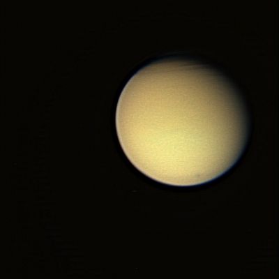 The Atmosphere of Titan
The view of Titan (almost natural colors) has been greatly contrast-enhanced to better show some intriguing structure in the North of the Planet; such intriguing "clouds-structure" is also clearly visible in a violet light view (PIA07701) taken at about the same time. 

The color view was created by combining images taken using red, green and blue spectral filters. The images were taken with the Cassini spacecraft wide-angle camera on Dec. 26, 2005, at a distance of approx. 193.000 Km (about 120.000 miles) from Titan and at a phase angle of 29°. The image scale is about 11 Km (roughly 7 miles) per pixel.
Parole chiave: Saturn's Moons - Titan