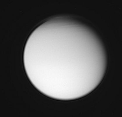 The atmosphere of Titan
This view of Titan reveals structure in the moon's complex atmosphere. The geometry of the Cassini spacecraft's view of Titan during this flyby was similar to that of Voyager 1's pass in 1980. 
The image was taken in visible violet light and shows the detached high haze layer that envelops Titan, with additional complexity to its structure in the far North. Some of this atmospheric structure is also visible in a color view (PIA07700) taken at about the same time.. 

The image was taken with the Cassini spacecraft wide-angle camera on Dec. 26, 2005, at a distance of approx. 194.000 Km (such as about 121.000 miles) from Titan and at a Sun-Titan-spacecraft, or phase, angle of 29°. The image scale is 11 Km (about 7 miles) per pixel.
Parole chiave: Saturn's Moons - Titan