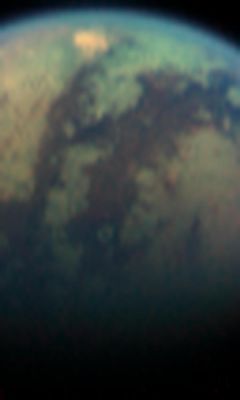 A bright Red Spot on Titan (2)
This dramatic color (but not true color) image was taken during the April 16, 2005, encounter with Titan. North is to the right. In the center it shows the dark lanes of the "H"-shaped feature discovered from Earth and first seen by Cassini last July shortly after it arrived in the Saturn system. At the southwestern edge of the "H" feature, near Titan's limb, is an area roughly 500 Km across. That area is 50% brighter when viewed using light with a wavelength of 5 microns, than the bright continent-sized area known as Xanadu. At wavelengths shorter than 5 microns, the spot is not unusually bright. The strange spectral character of this enigmatic feature has left the Team with 4 possibilities for its source: the spot could be a surface coloration, a mountain range, a cloud or a hot spot. The hot spot hypothesis will be tested during a Titan flyby on July 2, 2006, when the visual and infrared spectrometer will take nighttime images of this area. If it is hot, it will glow at night.
Parole chiave: Saturn's Moons - Titan