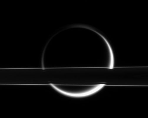 Shining through the Rings...
Caption originale:"Titan's smoggy atmosphere glows brilliantly in scattered Sunlight, creating a thin, gleaming crescent beyond Saturn's Rings. At this slight angle above the Ring-Plane, the thin F-Ring shines brightly. Light from Titan's eastern and western limbs (edges) penetrates the Cassini Division, which looks like a thin gap from this angle. 

The image was taken in visible light with the Cassini spacecraft narrow-angle camera on Jan. 18, 2006, at a distance of approx. 1 MKM (such as about 600.000 miles) from Saturn. Planet-sized Titan (5.150 Km, or 3,200 miles across) was 2,2 MKM (about 1,4 MMs) from Cassini at that time. The image scale is 13 Km (8 miles) per pixel on Titan".

Nota: crediamo che sia la prima volta in cui la NASA, nel fornire i dati contingenti sul frame (ivi, in particolare, la distanza Sonda-Oggetto Ripreso), aggiunge la precisazione "...at that time...". 
Ci teniamo a sottolineare che questo tipo di precisazione (a nostro parere fondamentale per far capire a tutti i Lettori - e soprattutto ai più giovani - che la "staticità" non appartiene al Cosmo) l'abbiamo introdotta noi, come Lun-Ex-It, in sede di integrazione dei dettati (captions) originali dei frames relativi a Saturno ed al suo Sistema.
Parole chiave: Saturn's Moons - Titan