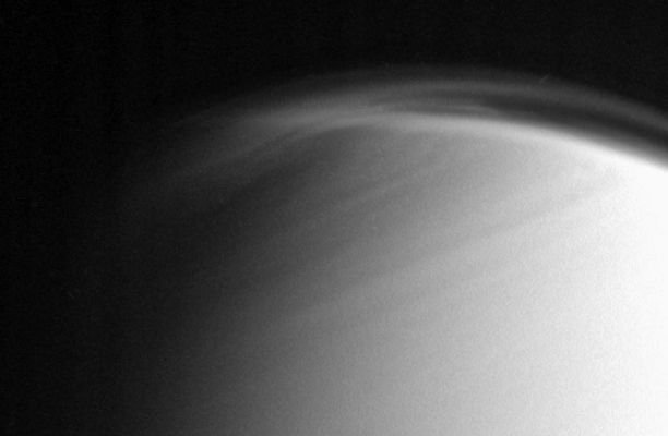 Titan's foggy Northern "Cap" (Original NASA/JPL/SSI b/w RAW Frame)
Caption NASA:"The complex and dynamic Atmosphere of Titan displays multiple Haze Layers near the North Pole in this view, which also provides an excellent look at the detached Stratospheric Haze Layer that surrounds the moon at lower Latitudes. 
North on Titan is up and rotated 20° to the left. 

The image was taken with the Cassini Spacecraft narrow-angle camera on March 16, 2006, using a filter sensitive to wavelengths of UltraViolet Light centered at 338 nanometers. The image was obtained at a distance of approx. 1,2 MKM (about 800.000 miles) from Titan and at a Sun-Titan-Spacecraft, or Phase, Angle of 68°. Image scale is approx. 7 Km (such as about 5 miles) per pixel". 
Parole chiave: Saturn's Moons - Titan