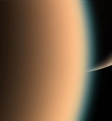Close "Friends"...
Caption NASA originale:"Cassini peers around the hazy limb of Titan to spy the sunlit South Pole of Saturn in the distance beyond. 
The thick, smog-like atmosphere of frigid Titan is a major source of interest for the Cassini mission. The moon is 5.150 Km (about 3.200 miles) across. 

Images taken using red, green and blue spectral filters were combined to create this natural-color view. The image was taken with the Cassini spacecraft narrow-angle camera on Dec. 26, 2005, at a distance of approx. 26.000 Km (about 16.000 miles) from Titan. Image scale is roughly 1 Km (4.643 feet) per pixel".
Parole chiave: Saturn and Titan