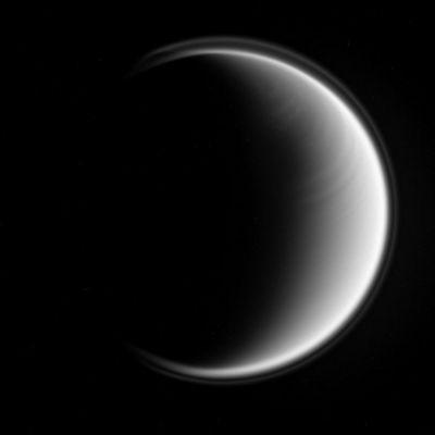Titanian "Bands"
Caption NASA:"Titan bears a distinct East-West banded pattern in this Cassini spacecraft image taken in the ultraviolet. 
The ultraviolet wavelength allows Cassini to see Titan's stratosphere, where superrotation -- in which the atmosphere moves around the moon faster than Titan rotates -- is strong. The recent appearance of this feature may be a harbinger of seasonal change on Titan. 

The moon's halo -- its detached, high-altitude global haze layer -- is visible here as well, and is often its most prominent feature in such ultraviolet views. North on Titan is up and rotated 6° to the right in this image. 

The view was obtained by the Cassini spacecraft narrow-angle camera using a spectral filter sensitive to wavelengths of polarized ultraviolet light. 
The view was acquired on Dec. 25, 2006 at a distance of approx. 1,3 MKM (about 800.000 miles) from Titan and at a Sun-Titan-spacecraft, or phase, angle of 123°. 
Image scale is roughly 8 Km per pixel".
Parole chiave: Saturn's Moons - Titan