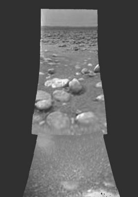 The surface of Titan (again)
Original caption:"Images from the European Space Agency's Huygens probe descent imager/spectral radiometer side-looking imager and from the medium resolution imager, acquired after landing, were merged to produce this image. 
The horizon's position implies a pitch of the imager/spectral radiometer, nose-upward, by 1 to 2° with no measurable roll. The "stones" (?) in the foreground are 4 to 6" (10 to 15 cm) in size, presumably made of water ice and these lie on a darker, finer-grained substrate. 
A region with a relatively low number of rocks lies between clusters of rocks in the foreground and the background and matches the general orientation of channel-like features in the panorama of PIA06439. 
The scene evokes the possibility of a dry lakebed".
Parole chiave: Saturn's Moons - Titan