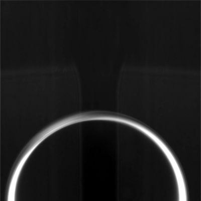 The "Dark Side" of Titan from about 107.000 Km
La Sonda Cassini-Huygens è passata accanto a Titano ed ora se ne sta rapidamente allontanando. Questa immagine è stata ripresa quando Titano era già stato superato di oltre 100.000 Km. Si tratta, come potete intuire, di una ripresa del lato di Titano immerso nella notte, mentre la luce che emerge dal bordo del Pianeta - formando una sorta di "aureola" - è causata dai raggi del Sole che passano attraverso gli strati superiori della sua atmosfera, generando un curioso fenomeno di diffusione luminosa. 
Questo tipo di immagine, oltre ad essere piuttosto suggestiva, ci permette anche di vedere abbastanza bene i vari sub-strati in cui si suddivide (o sembra suddividersi...) l'atmosfera di Titano.
Parole chiave: Titan