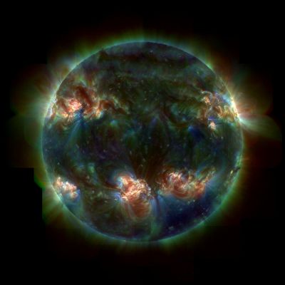 Ultraviolet Sun
Da "NASA - Picture of the Day" del 10 Luglio 2006:"Is this our Sun? 
Yes. Even on a normal day, our Sun is sizzling ball of seething hot gas. Unpredictably, regions of strong and tangled magnetic fields arise, causing sunspots and bright active regions. The Sun's surface bubbles as hot Hydrogen gas streams along looping magnetic fields. These active regions channel gas along magnetic loops, usually falling back but sometimes escaping into the Solar Corona or out into space as the solar wind. Pictured above is our Sun in three colors of ultraviolet light. Since only active regions emit significant amounts of energetic ultraviolet light, most of the Sun appears dark. The colorful portions glow spectacularly, pinpointing the Sun's hottest and most violent regions. Although the Sun is constantly changing, the rate of visible light it emits has been relatively stable over the past 5 BY, allowing life to emerge on Earth".
Parole chiave: The Sun from Space