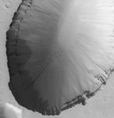Collapse Pit in Tractus Fossae (Original NASA/MGS/MSSS b/w Frame)
Original Caption:"This MGS-MOC image shows a 1,5 meters (5 feet) per pixel view of a large Collapse Pit in the Tractus Fossae portion of the Tharsis Region of Mars. Such collapses usually occur along faults formed by expansion and pulling apart of the Planet's Upper Crust". 

Location near: 22,5° North Lat. and 101,4° West Long.
Image width: width: ~3 Km (~1,9 mi) 
Illumination from: lower left 
Season: Northern Autumn
Parole chiave: Mars from orbit - Volcanic Features - Collapse Pit