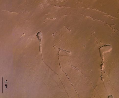 Ascraeus Mons from Mars Express (1 - ESA/ DLR/ FU Berlin - G. Neukum)
Due immagini in colori naturali del Vulcano Ascraeus Mons e dei suoi rilievi assolutamente affascinanti. 
Ed eccoVi la Caption ESA originale:"This colour image shows a larger portion of the southern flank of Ascraeus Mons. The lighter, pink areas on the colour image, are clouds. 
The visible lava tubes are caused by the crusting (or cooled lava) which occurs over a lava channel, a covering making the channel into a tunnel. 
When lava production ceases, the tunnel empties and the roof of the tunnel falls in, making an elongated depression. 
Occasionally, the depression forms a chain of small pits over an emptied lava tunnel. Pit chains and lava tunnels are common on the Martian surface and are also seen on other terrestrial planets and the Moon".
Parole chiave: Mars from orbit - Ascraeus Mons