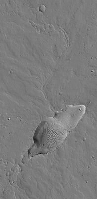 Lost in the Dust: a small Volcano in Jovis Fossae (Original NASA/MGS/MSSS b/w Frame)
Caption NASA originale:"This MGS-MOC image shows a small, dust-covered, volcano in the Jovis Fossae region of Mars. While Mars is known for its extremely large volcanoes, such as Olympus Mons, many small volcanoes also occur on the Red Planet, particularly in the Tharsis Region. This small volcano is a good example of those. It was originally found by members of the MGS Mars Orbiter Laser Altimeter (MOLA) team during the MGS primary mission. The volcano is old and cratered. Its surface is mantled by dust and its caldera (summit depression) has some dust-covered wind ripples on its floor". 

Location near: 20,7° North and 111,3° West
Image width: ~3 Km (~1,9 mi)  
Illumination from: lower left  
Season: Northern Autumn
Parole chiave: Mars from orbit - Volcanoes