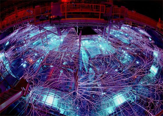 The Heart of a Star...On Earth: the Z Machine
Why is this plasma so hot? Physicists aren't sure. What is known for sure is that the Z Machine running at Sandia National Laboratories created a plasma that was unexpectedly hot. The plasma reached a temperature in excess of two billion Kelvin (!), making it arguably the hottest human made thing ever in the history of the Earth and, for a brief time, hotter than the interiors of stars. The Z Machine experiment, pictured above, purposely creates high temperatures by focusing 20 million amps of electricity into a small region further confined by a magnetic field. Vertical wires give the Z Machine its name. During the unexpected powerful contained explosion, the Z machine released about 80 times the world's entire electrical power usage for a brief fraction of a second. Experiments with the Z Machine are helping to explain the physics of Solar flares, design more efficient nuclear fusion plants, test materials under extreme heat, and gather data for the computer modeling of nuclear explosions. 
Parole chiave: Experiments