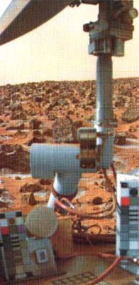 Color snap-shots from Viking 1 (7)
"...In the course of the Martian Year an important surface change was observed at the Viking 1 site. During the Winter months a thin layer of frost formed. This is documented by comparing two black and white pictures, the first taken early in the mission in late Martian Summer and the second taken months later in late Martian Winter. 
Patches of receding frost were visible in the 2nd picture. During the height of Winter, frost probably covered the entire surface. 
This picture is a color image of the frost, looking across the spacecraft. The colors purposely have been distorted slightly to enhance color contrast.

The frost persists at temperatures higher than those required for frozen Carbon Dioxide (dry ice). 
It may be Water Ice or a Carbon Dioxide clathrate, a crystalline mixture of H2O and CO2".

Parole chiave: Martian Surface - frost