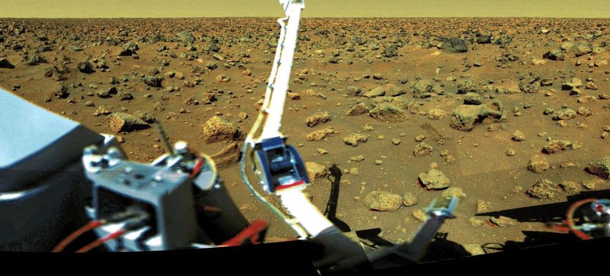 From the "Viking Archive" - Viking 2: full panorama
Caption NASA originale:"The Viking Lander 2 site in Utopia Planitia has more and larger blocks of stone than does the Viking Lander 1 site in Chryse Planitia. The stones are probably ejecta from impact craters near the Lander 2 site. Many of the rocks are angular and are thought to be only slightly altered by the action of wind and other forms of erosion. Drifts of sand and dust are smaller and less noticeable at the Lander 2 site. The overall red/orange coloring of the Martian terrain is due to the presence of oxidized iron in the regolith. The pink color of the sky is caused by extremely fine dust that is suspended in Mars' thin atmosphere". 

Nota: 1) il cielo, in questa immagine in "almost true colors", noi lo vediamo verdastro e non rosa; 2) se l'atmosfera Marziana fosse davvero sottilissima, il cielo dovrebbe apparire MOLTO più SCURO di quanto invece non appare nelle immagini (rosso/arancio scuro nelle ore del giorno pieno - e cioè fra le 10 e le 15 MLT -, azzurro scuro con il "dimming").
Parole chiave: Mars Panorama