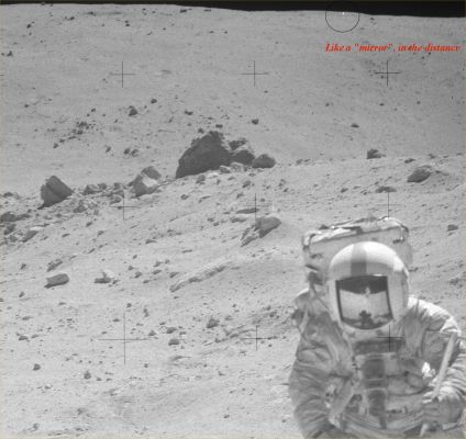 AS 16-106-17336 - Bright object (?) over the Hill (context image)
Un riflesso metallico indecifrabile o un ingannevolissimo photoartifact? Abbiamo provato con il solito stretching estremo ed il risultato ottenuto è che, a nostro parere, NON si tratta di un photoartifact, bensì di un corpo reale ad elevatissima riflettenza (quale potrebbe essere il Lunar Module) distante tra gli 800 ed i 1000 metri dal punto di ripresa.

In questo frame, la visione contestuale di AS 106-17336 e la caption NASA originale:"167:24:45 MT - Charlie (Duke) turned to get this "locator" to House Rock. The tongs are stuck in the ground as a substitute for the broken gnomon. John has the rake. House Rock is the very large boulder beyond John's right shoulder".
Parole chiave: Lunar Surface - Controversial