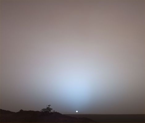 Virtual Presence in Space
This synthetic image of the Spirit MER on top of a rock called "Jibsheet" was produced using "Virtual Presence in Space" technology. Developed at NASA's Jet Propulsion Laboratory, Pasadena, Calif., this technology combines visualization and image-processing tools with Hollywood-style special effects. The image was created using a photorealistic model of the Rover and a false-color mosaic. The size of the Rover in the image is approximately correct and was based on the size of the Rover tracks in the mosaic. The mosaic was assembled from frames taken by the Pan-Cam on the Rover's 489th Martian day (May 19, 2005); see PIA07997. 

Because this synthesis provides viewers with a sense of their own "virtual presence" (as if they were there themselves), such views can be useful to mission teams in planning exploration by enhancing perspective and a sense of scale.
Parole chiave: Postcards from Mars - Mars Horizon